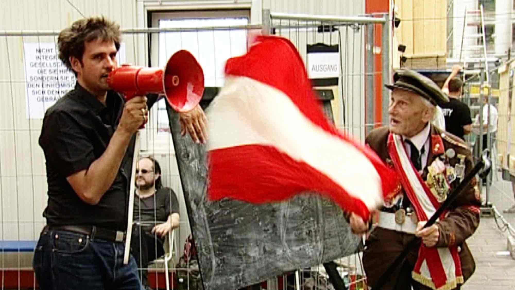 Gesellschaftskritik und Satire: LWL Museum für Kunst und Kultur zeigt Film »Ausländer raus! Schlingensiefs Container«, 11. Juni 2025 Gesellschaftskritik und Satire: LWL Museum für Kunst und Kultur zeigt Film »Ausländer raus! Schlingensiefs Container«, 11. Juni 2025